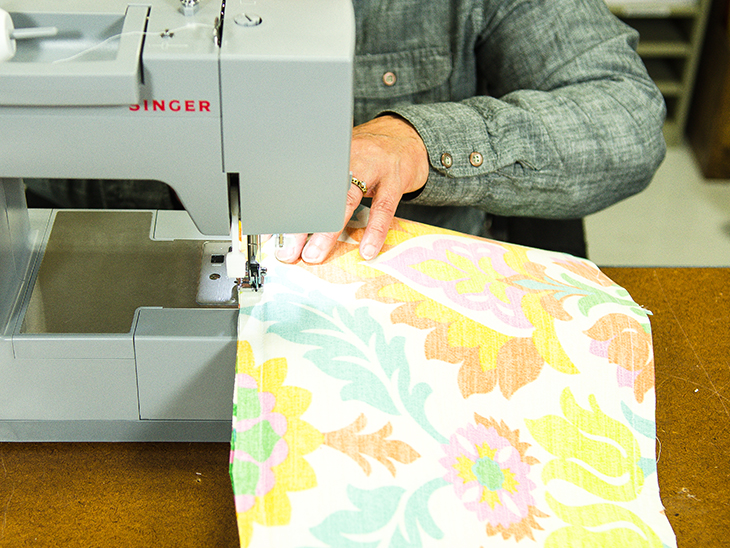 Sew around the perimeter of the pillow, leaving an opening at the bottom to insert stuffing.